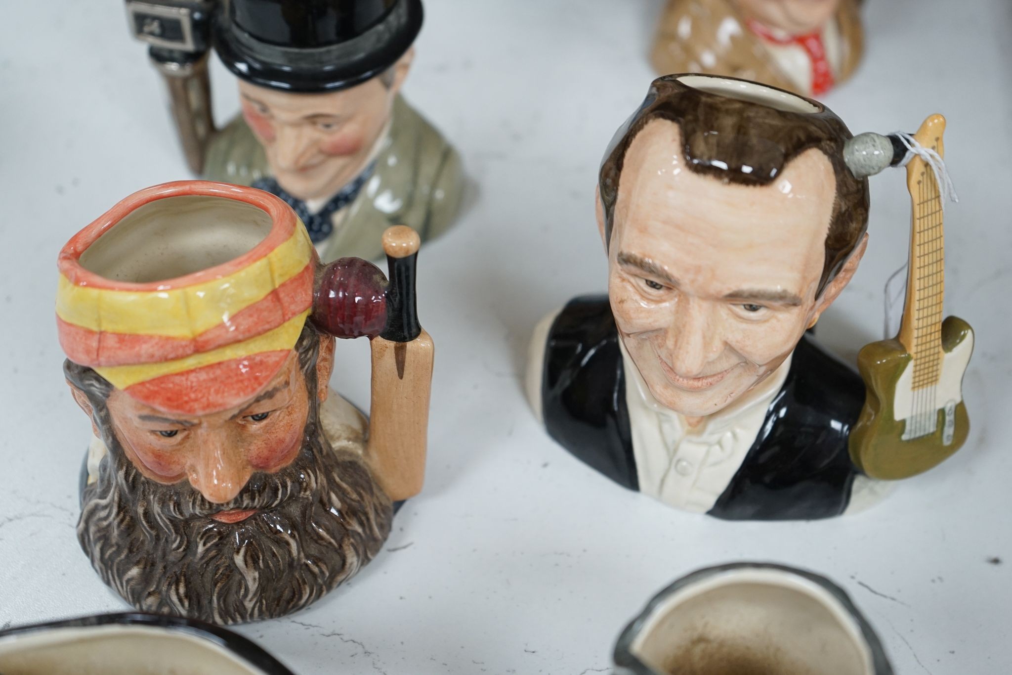 A collection of Royal Doulton character jugs, most boxed